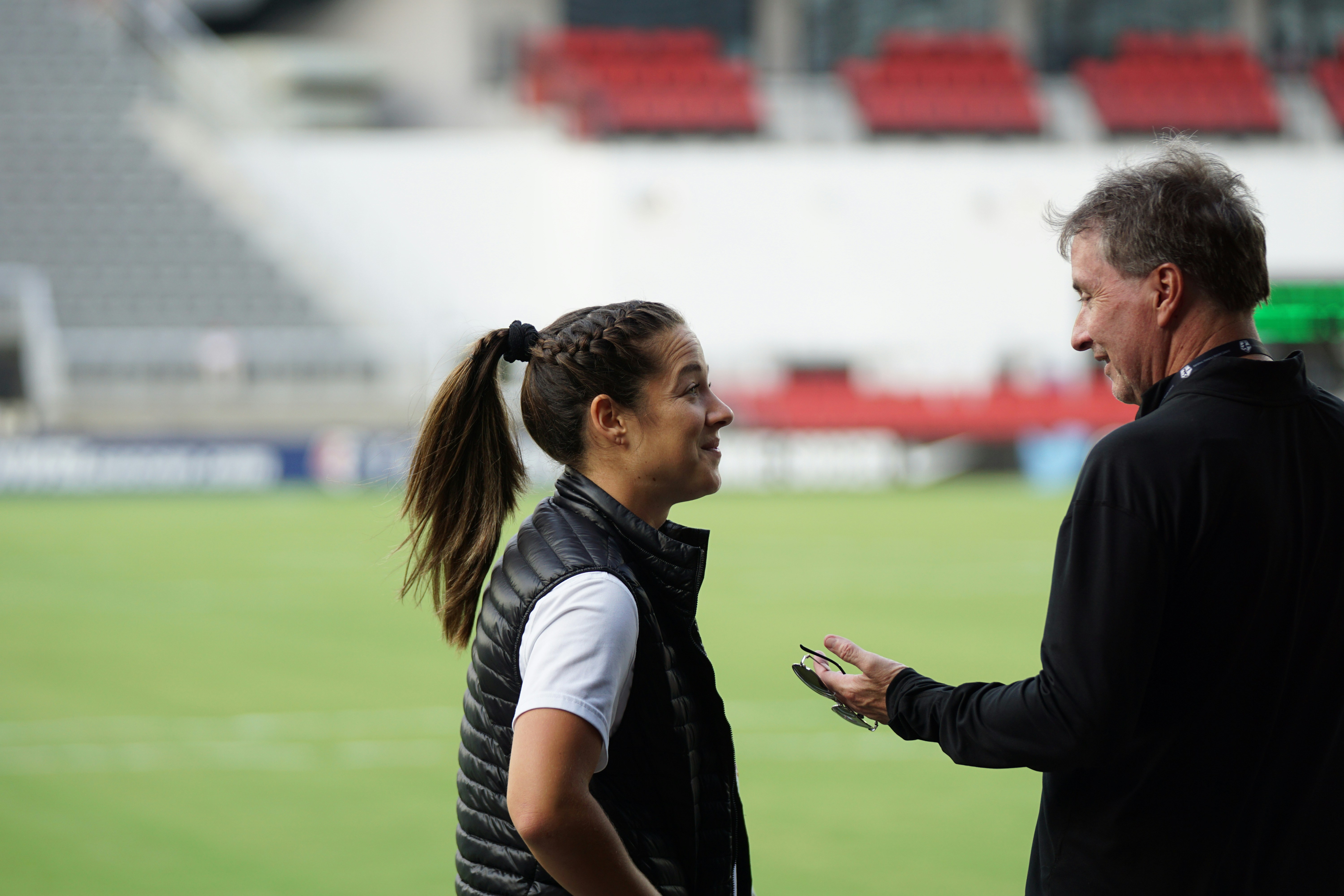 A female soccer player talking to her male coach: Best Soccer Support System 