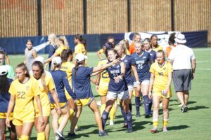 A team of female footballers walking out the pitch: Best Soccer Support System 