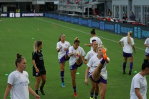 Women footballers doing gameday training warm ups: cardio workouts