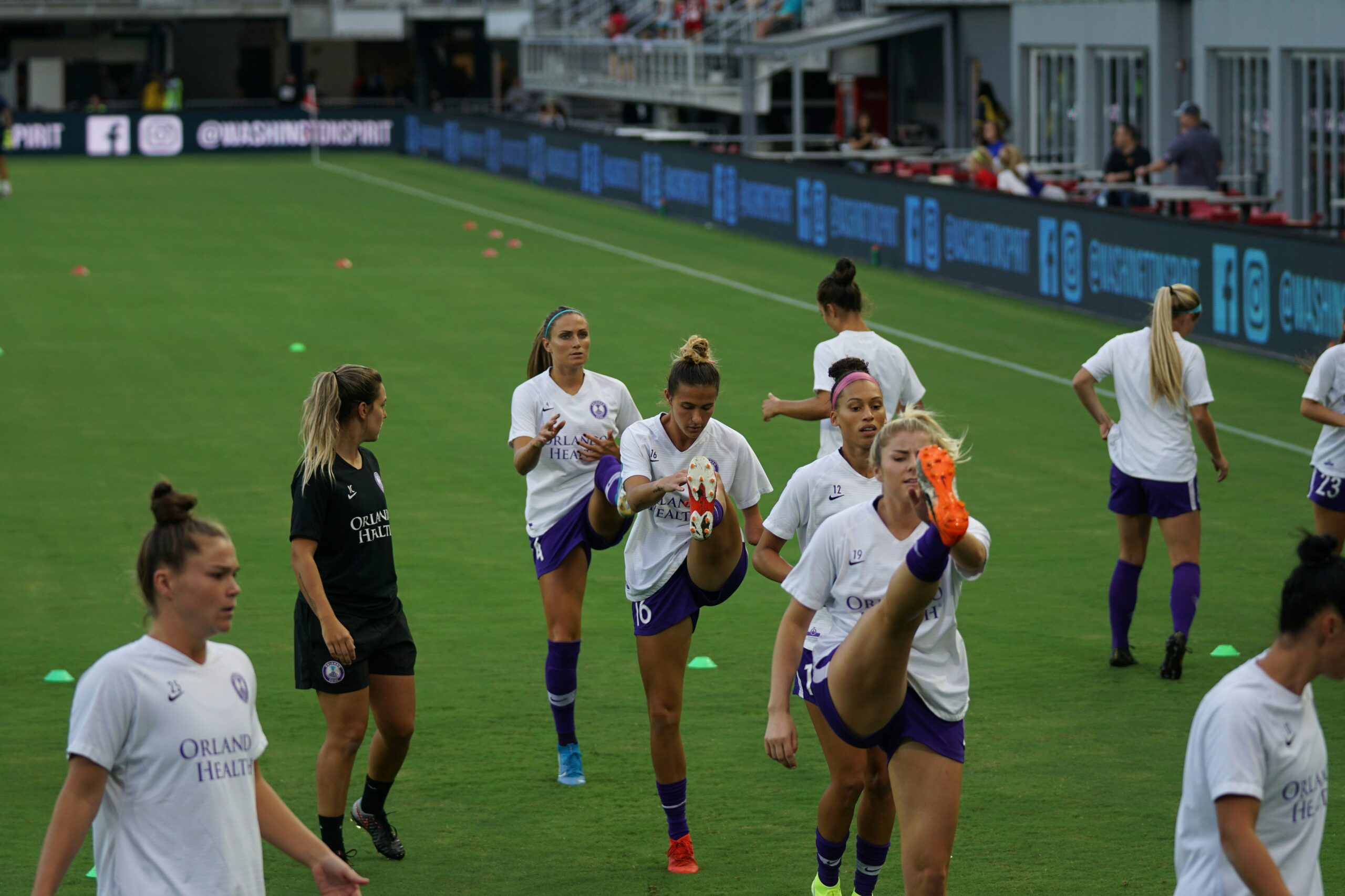 Women footballers doing gameday training warm ups: cardio workouts