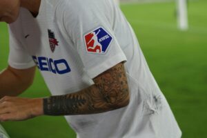 NWSL player signing an autograph: Most Popular Women's Football Leagues