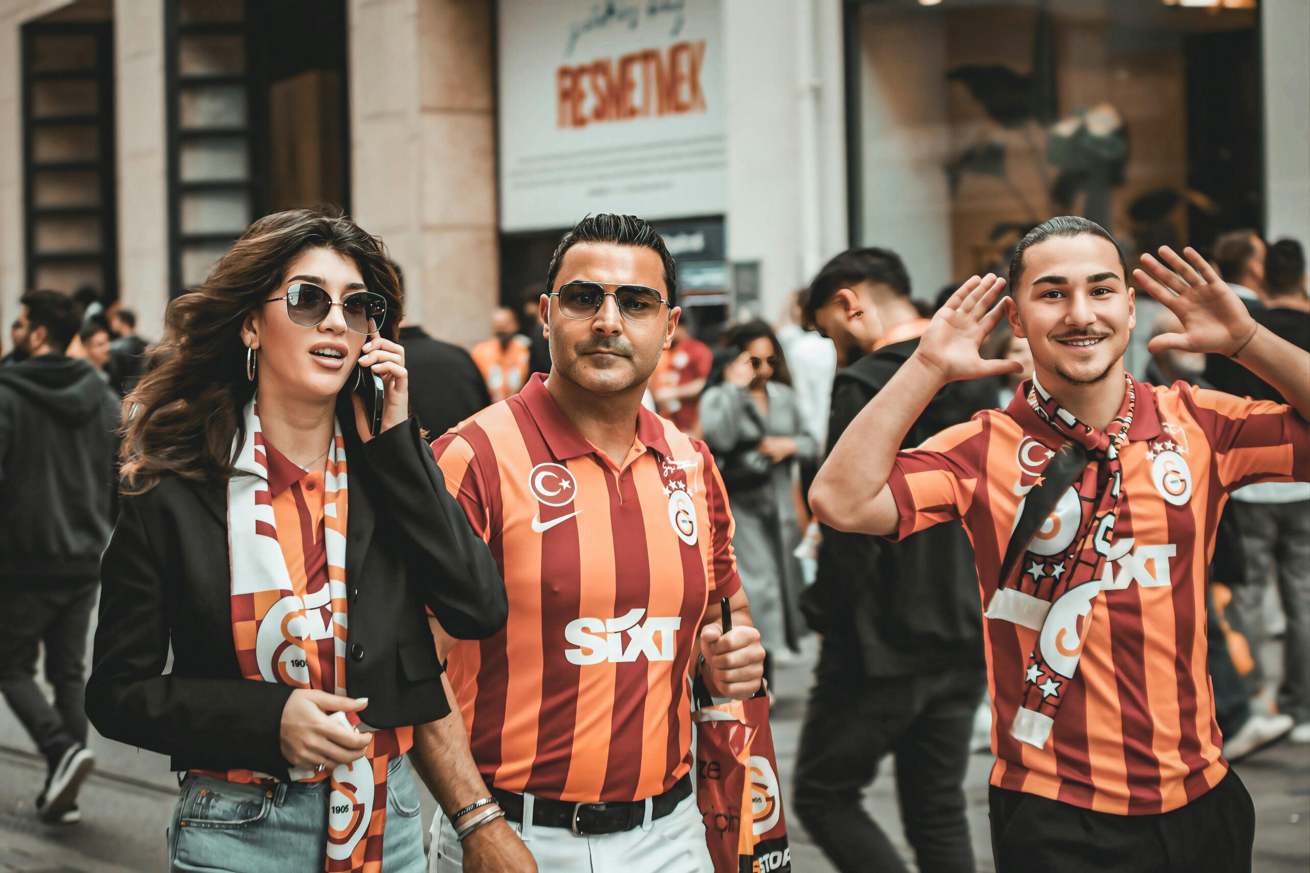 Football fans in Galatasaray football jersey walking on the street: Stylish Outfit Ideas to Rock