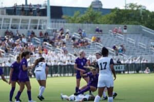 A group of soccer female ladies playing during soccer matchday