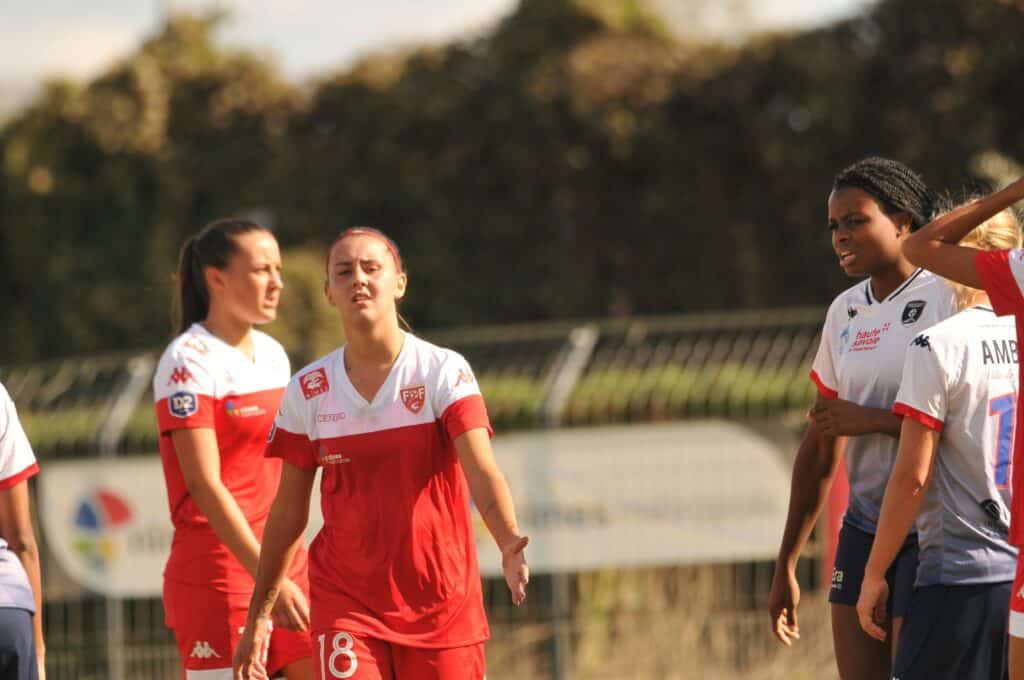 Female soccer players wearing red and white soccer uniform during a match day: Ups and downs of learning soccer